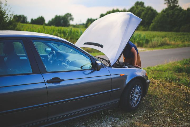 car on side of the road needs repair