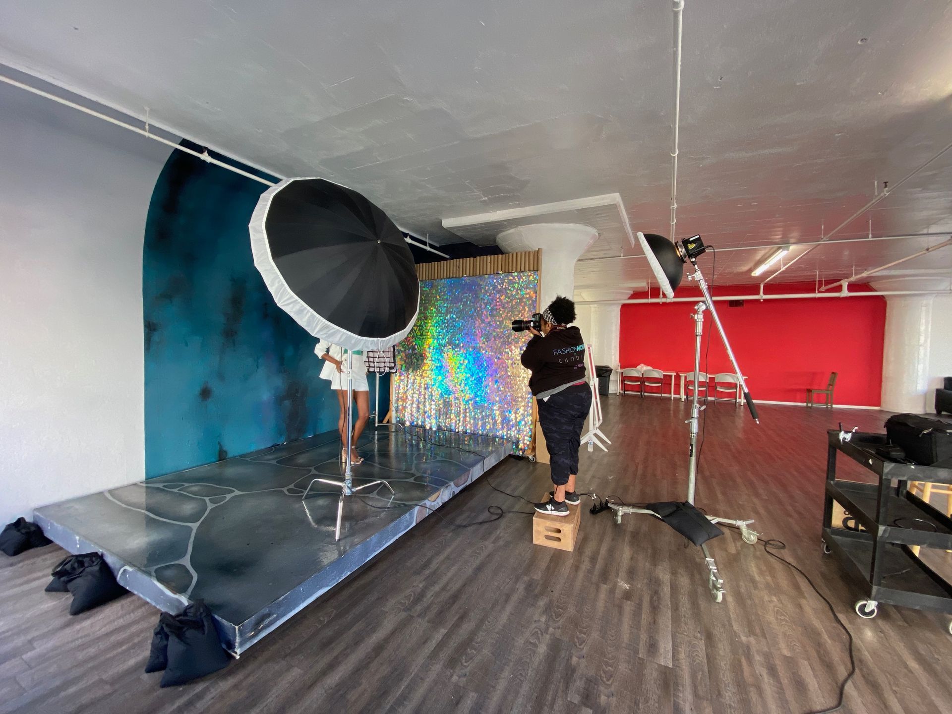Awnica photographing her client's headshots in the studio