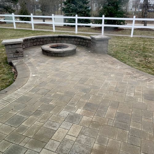 There is a fire pit in the middle of the patio.