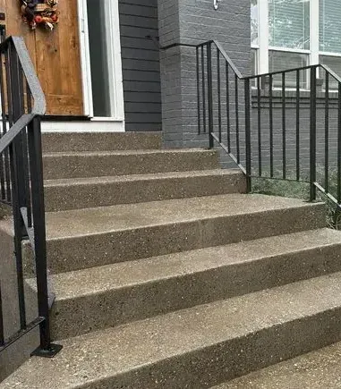 A large house with a patio and stairs in front of it in Portland OR