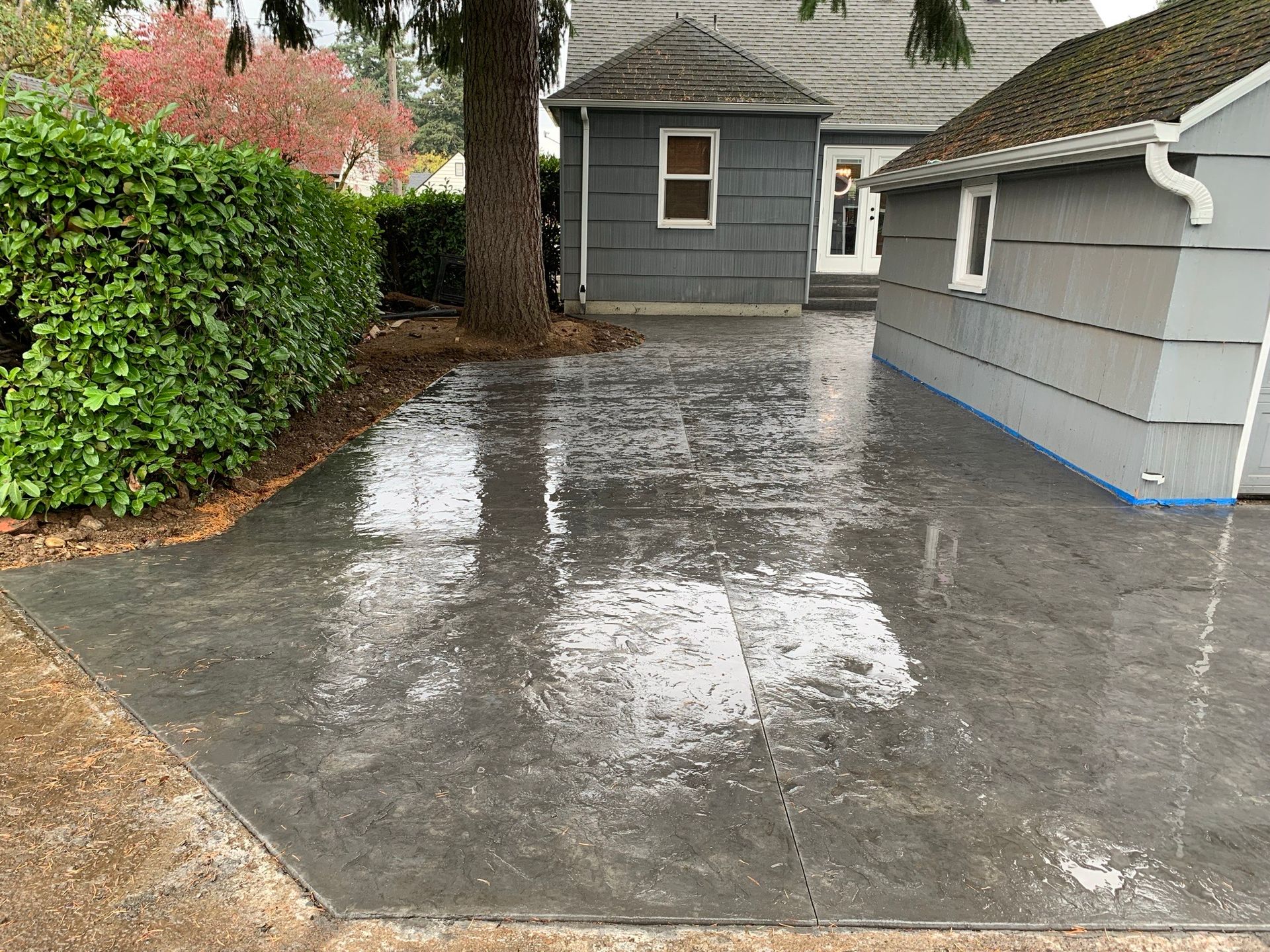 A concrete driveway in front of a house in Portland OR