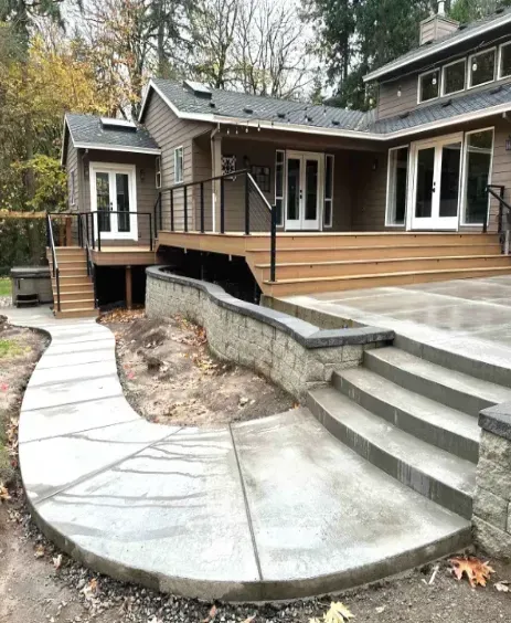 A large house with a patio and stairs in front of it in Portland OR