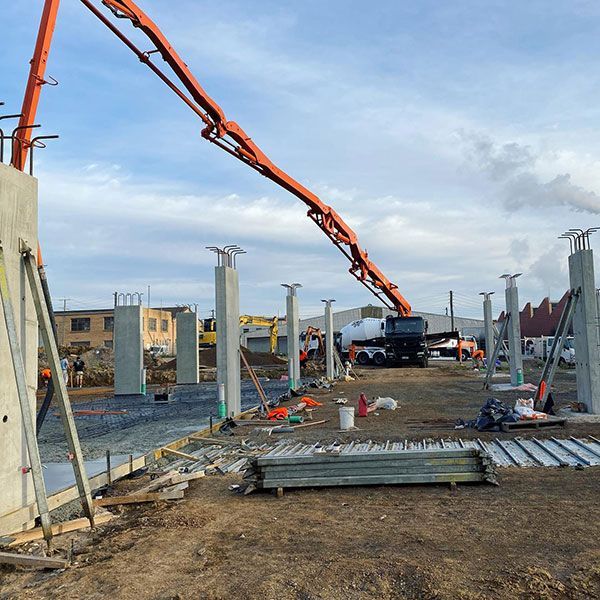 A concrete pump is being used on a construction site