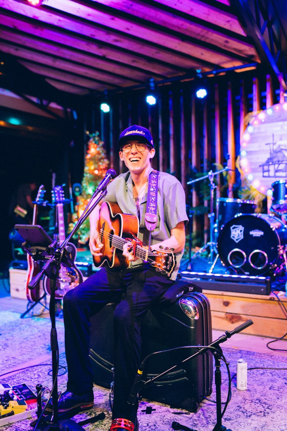 A guitarist performing on the Sugarshack Downtown stage