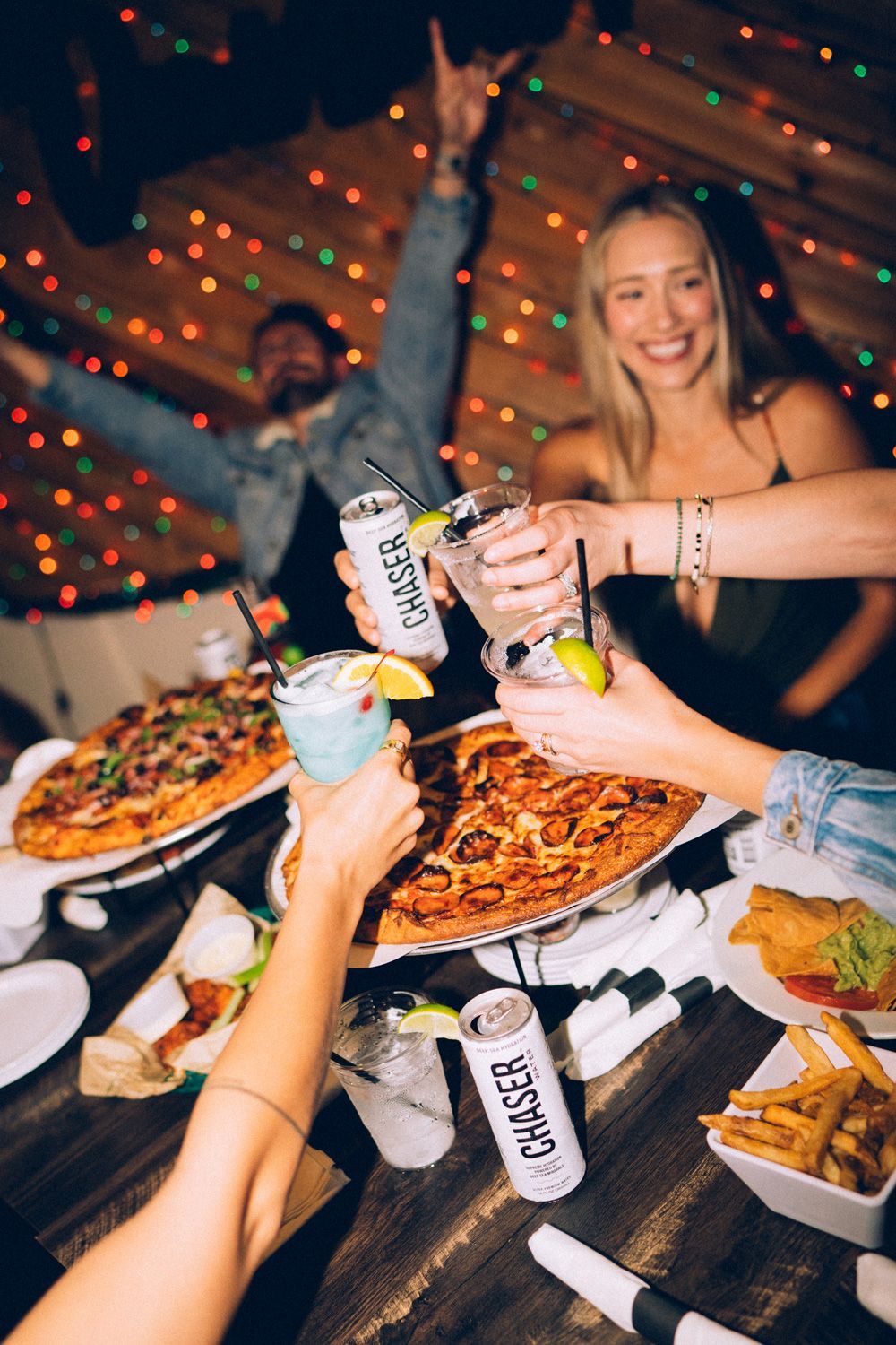 Guests sharing food, drinks, and a lively night at Sugarshack Downtown