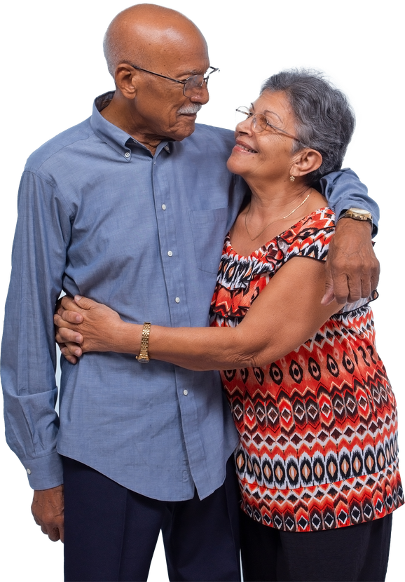 An elderly couple hugging each other on a white background.