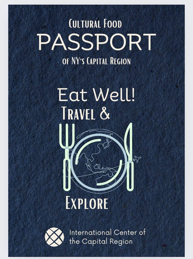 Cultural food passport poster with navy background, plate and utensils, promoting “Eat Well, Travel & Explore.”