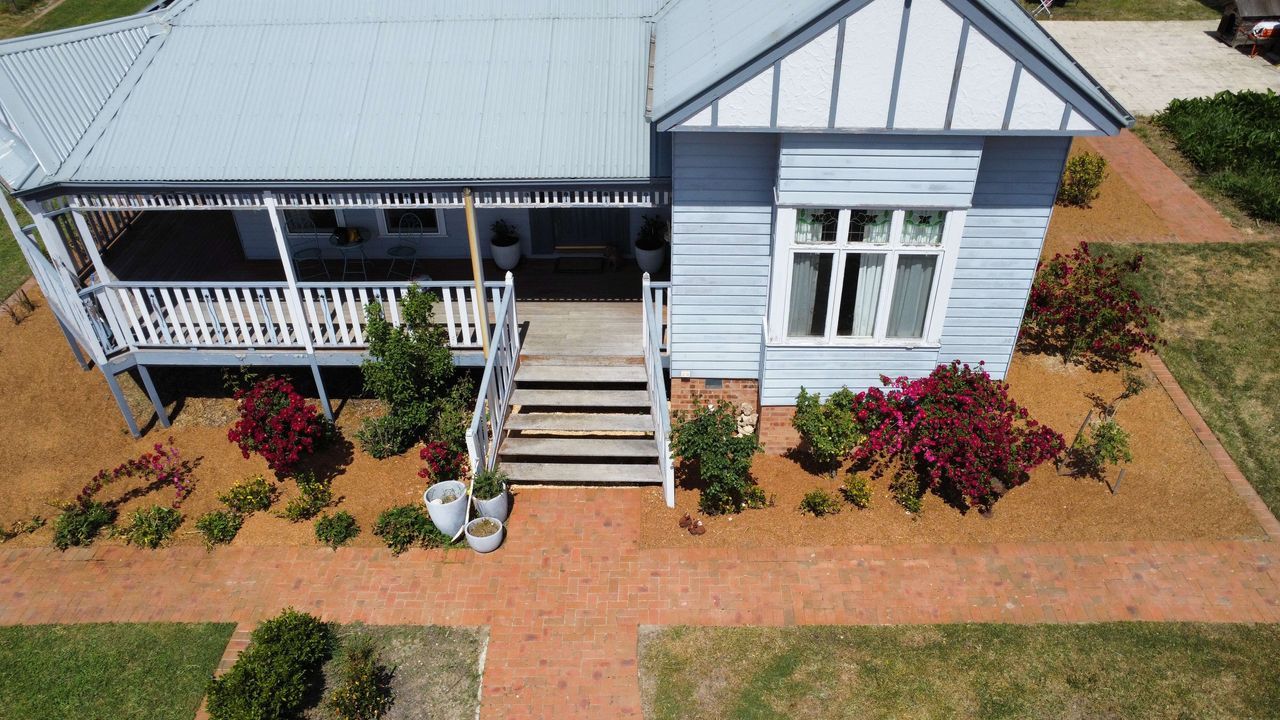 After A House With A Grassy Area In Front Of It — Canberra Home and Garden Maintenance in Tuggeranong ACT