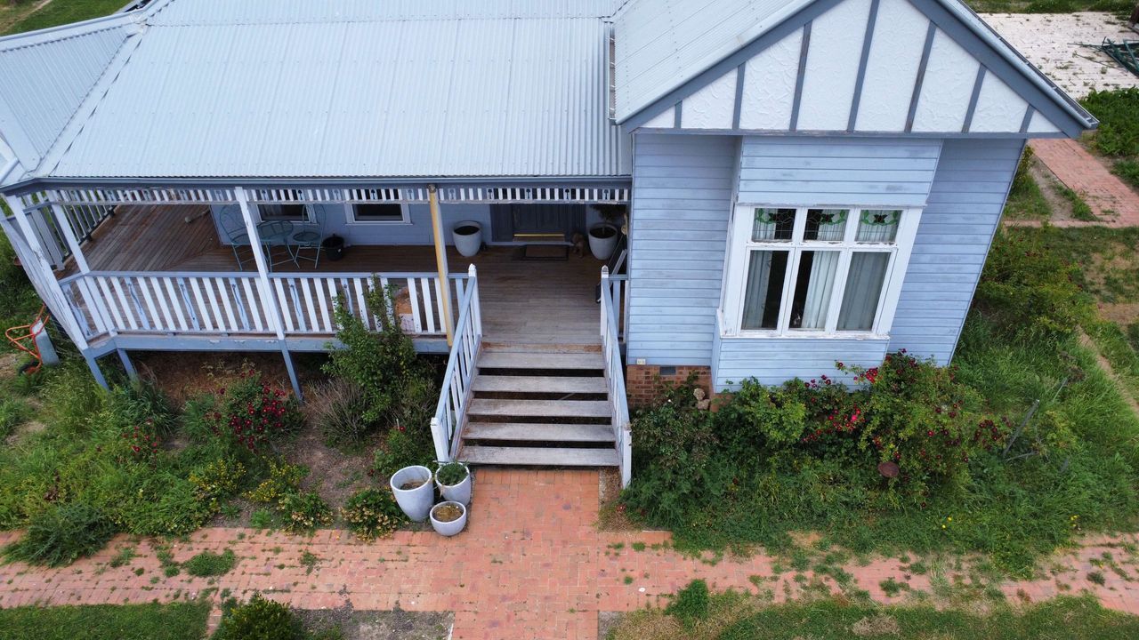 Before A House With A Grassy Area In Front Of It — Canberra Home and Garden Maintenance in Tuggeranong ACT