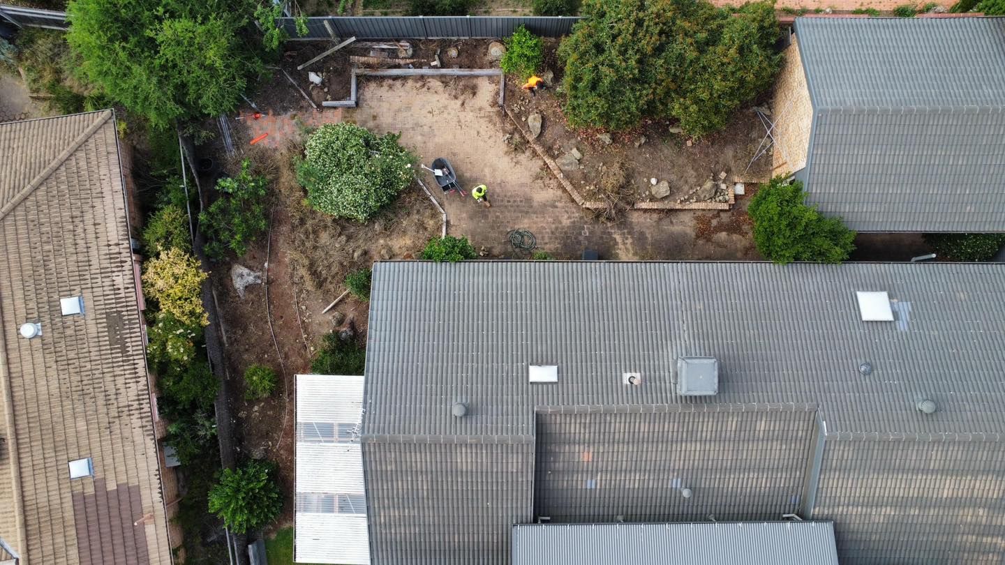 Before A brick house with a stone walkway in front of it — Canberra Home and Garden Maintenance in Tuggeranong ACT