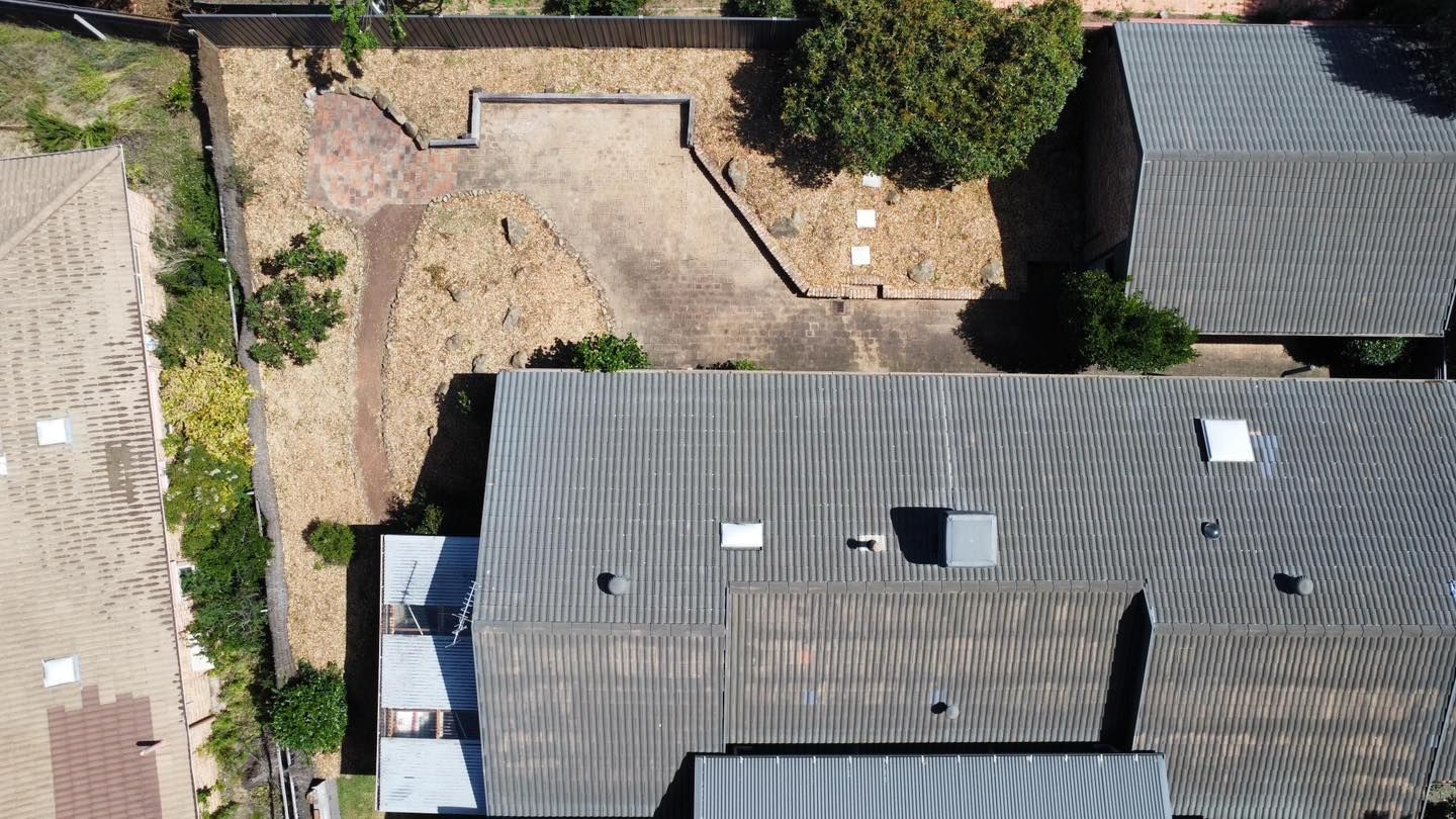 After A Brick House With A Stone Walkway Leading To It — Canberra Home And Garden Maintenance In Tuggeranong Act