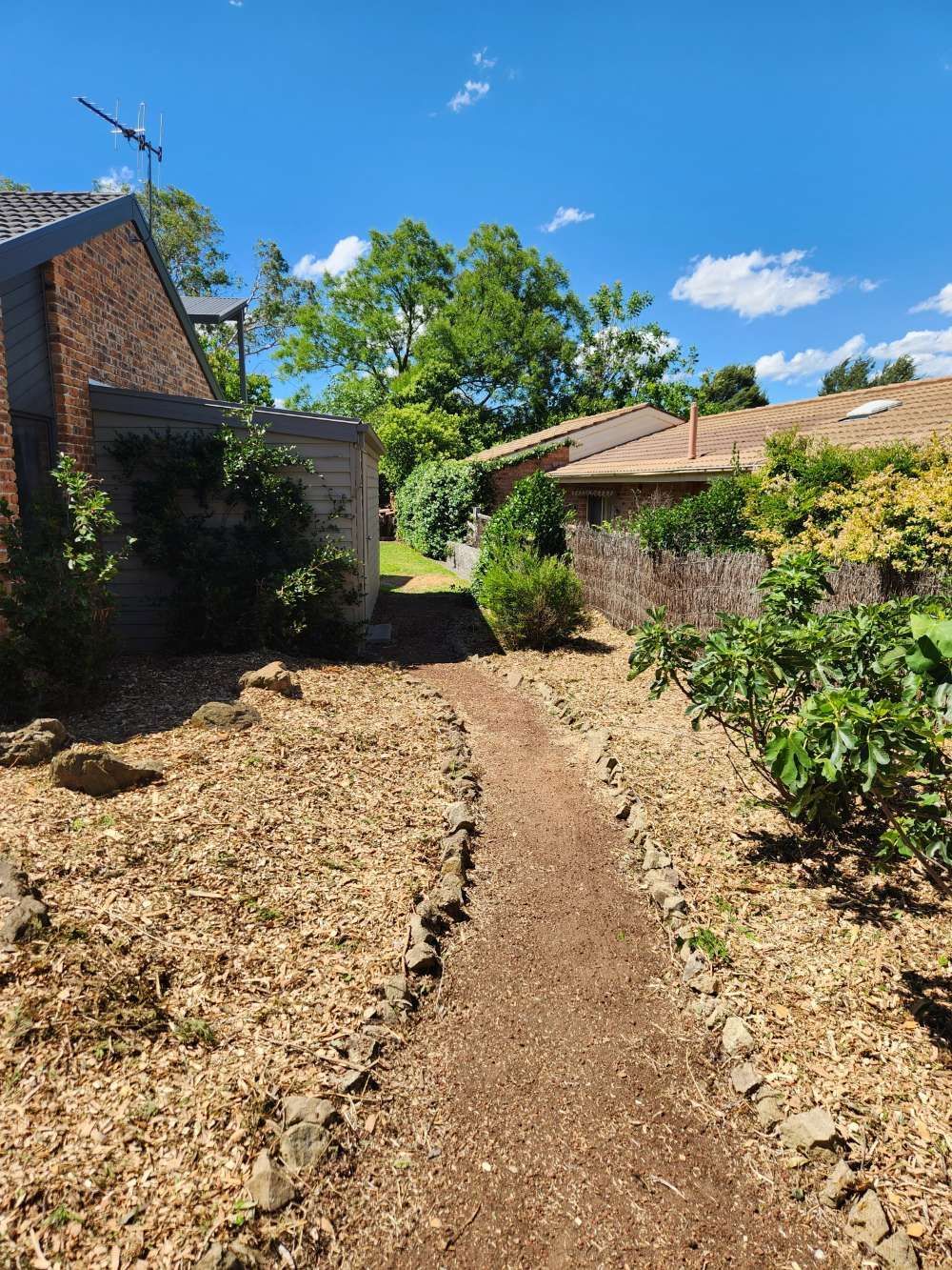 After A Dirt Path Leading To A House In A Residential Area — Canberra Home and Garden Maintenance in Tuggeranong ACT