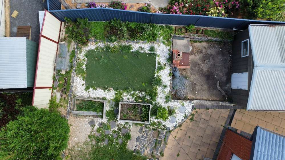Before An Aerial View Of A Backyard With A Pool And A Fence — Canberra Home and Garden Maintenance in Tuggeranong ACT