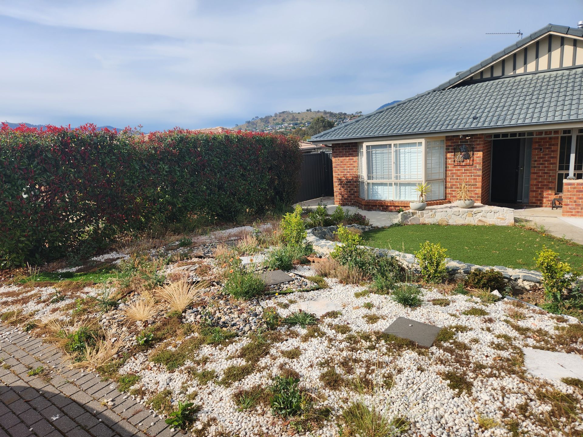 Before A Wooden Deck Overlooking A Lake With A Fence Surrounding It — Canberra Home and Garden Maintenance in Tuggeranong ACT