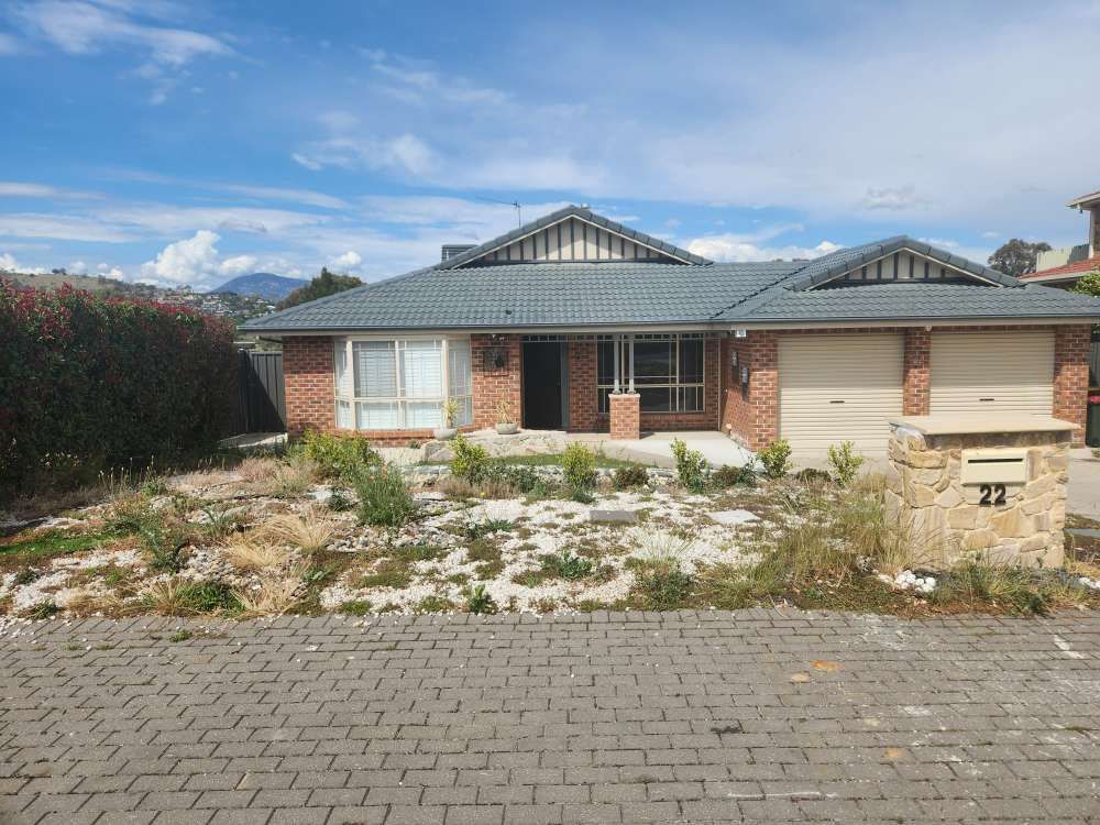 Before A Brick House With A Gray Roof And A Mailbox In Front Of It — Canberra Home and Garden Maintenance in Tuggeranong ACT