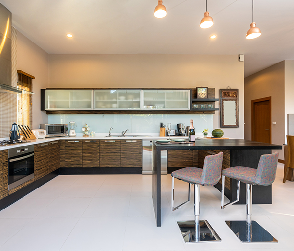 A kitchen with wooden cabinets and stainless steel appliances