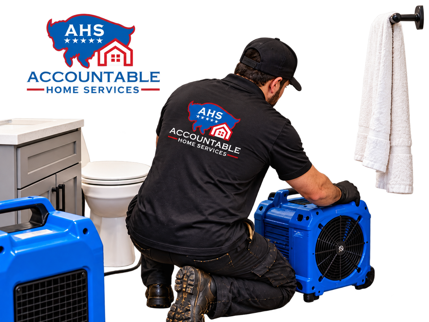 AHS technician inspecting and drying water damage in a small bathroom in Thornton, Colorado