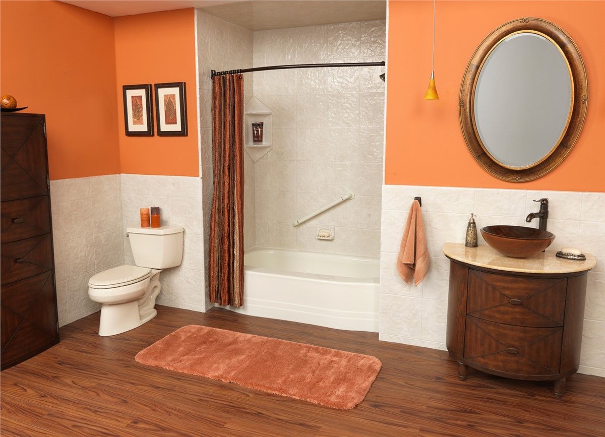 A bathroom with a toilet , sink , and shower.