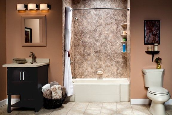 A bathroom with a sink , toilet , bathtub and mirror.
