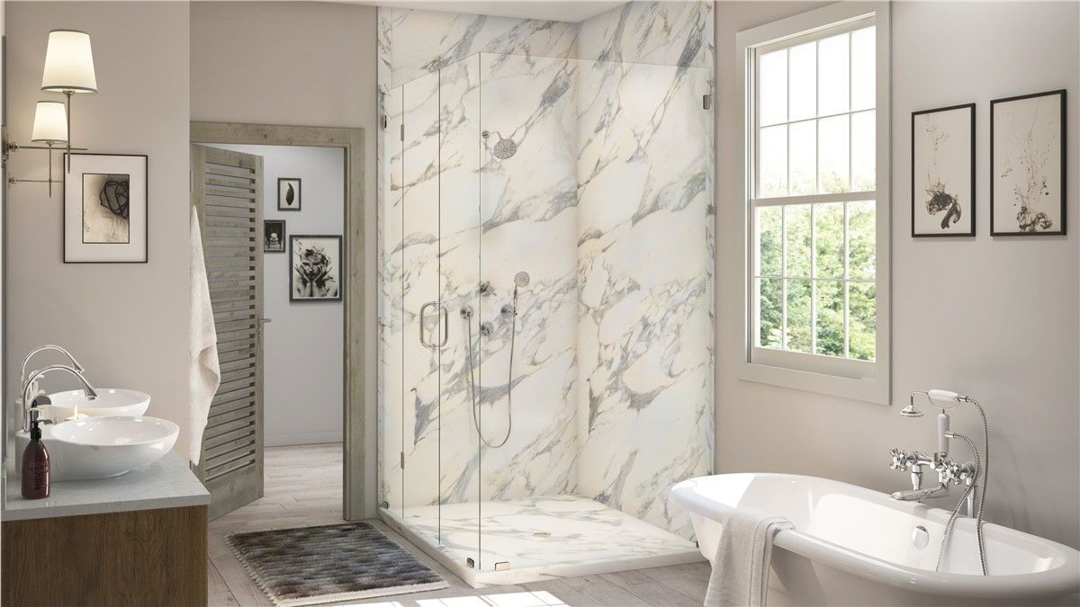 A bathroom with a walk in shower , sink , tub and window.