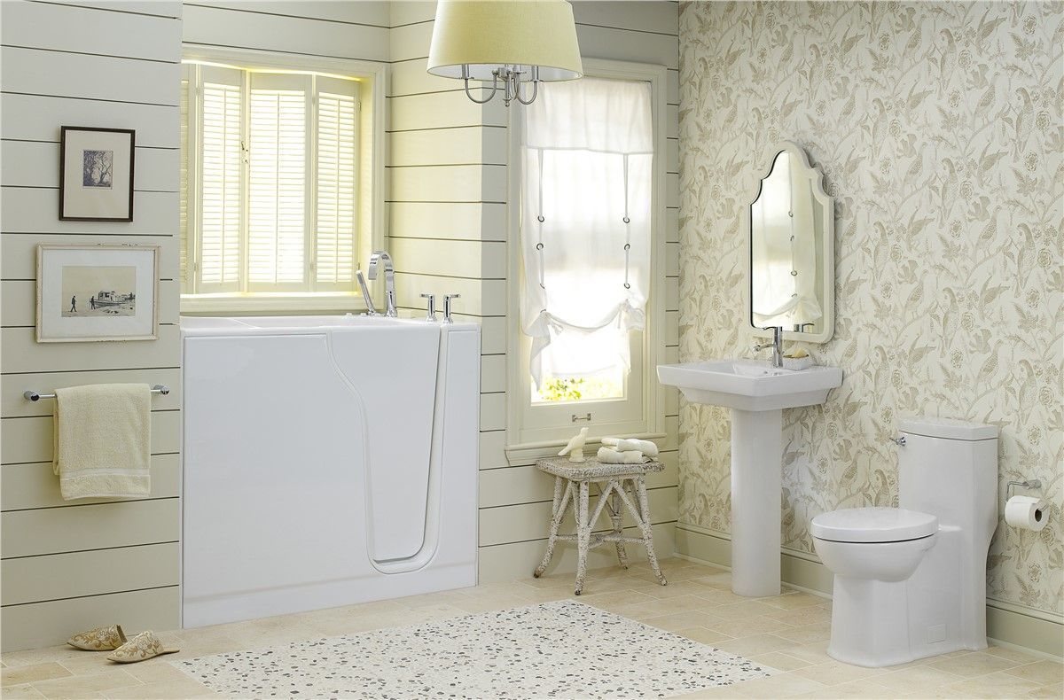 A bathroom with a toilet a sink and a window