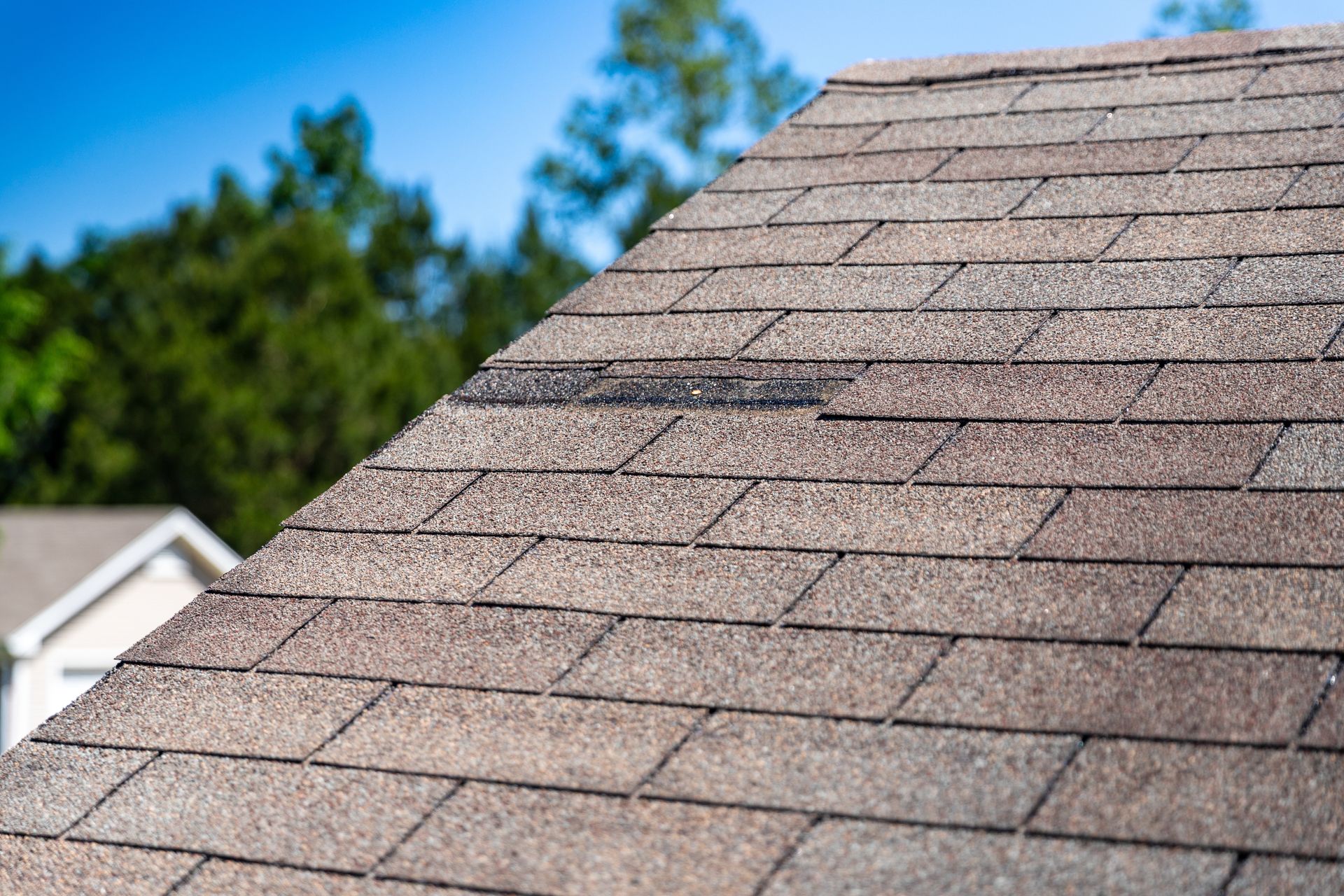 An aerial view of a roof that is being repaired