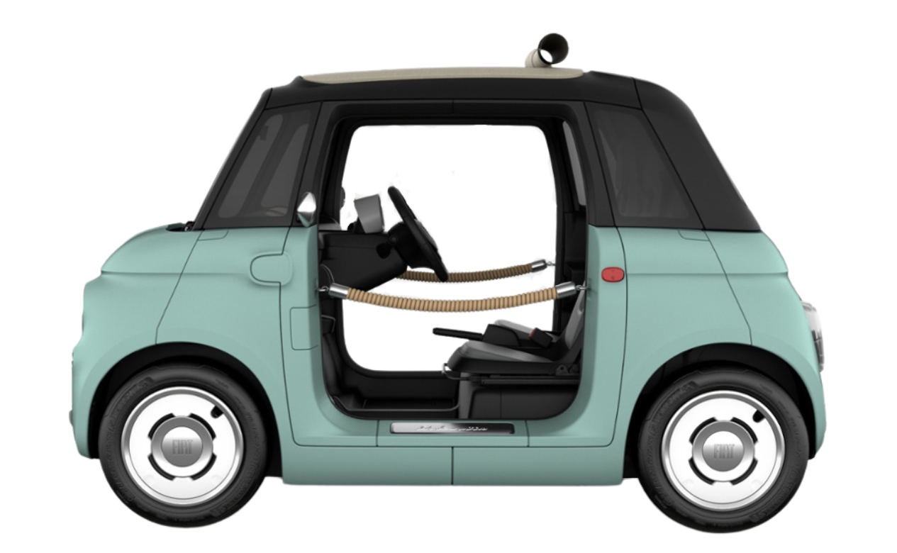 Side view of a mint green compact car with a black roof and open door, showing interior wheelchair seating.