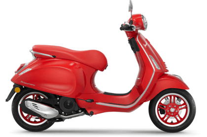 Red scooter side view on a white background with red body, chrome details, and red wheels