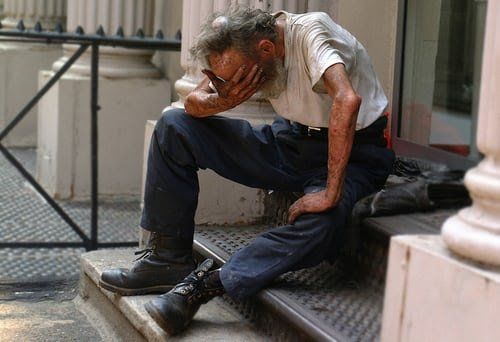 Man crying on staircase
