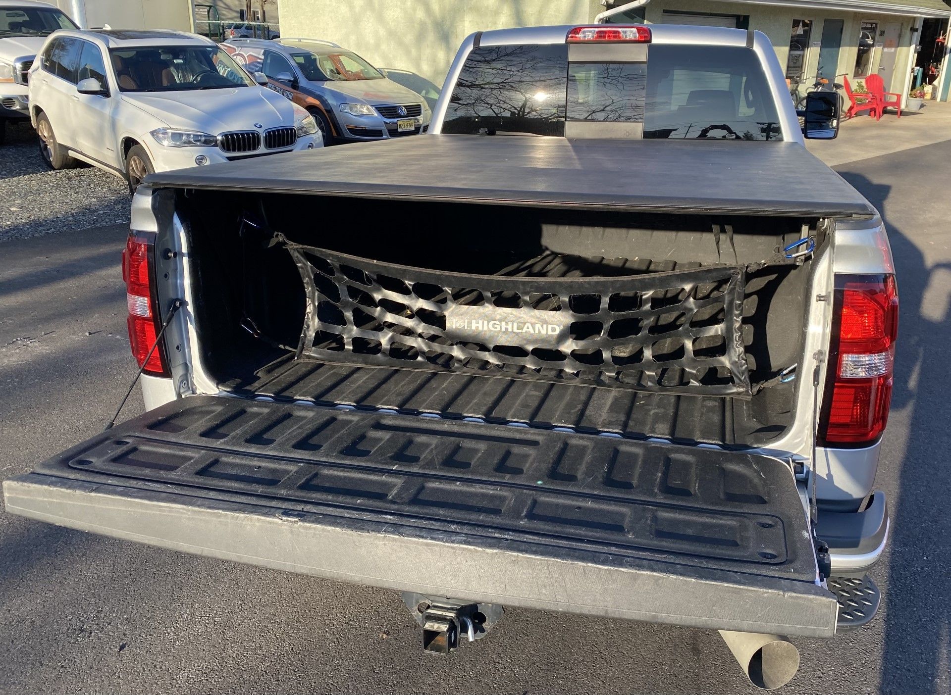 The back of a silver pickup truck with the bed open. | InTown Auto Care