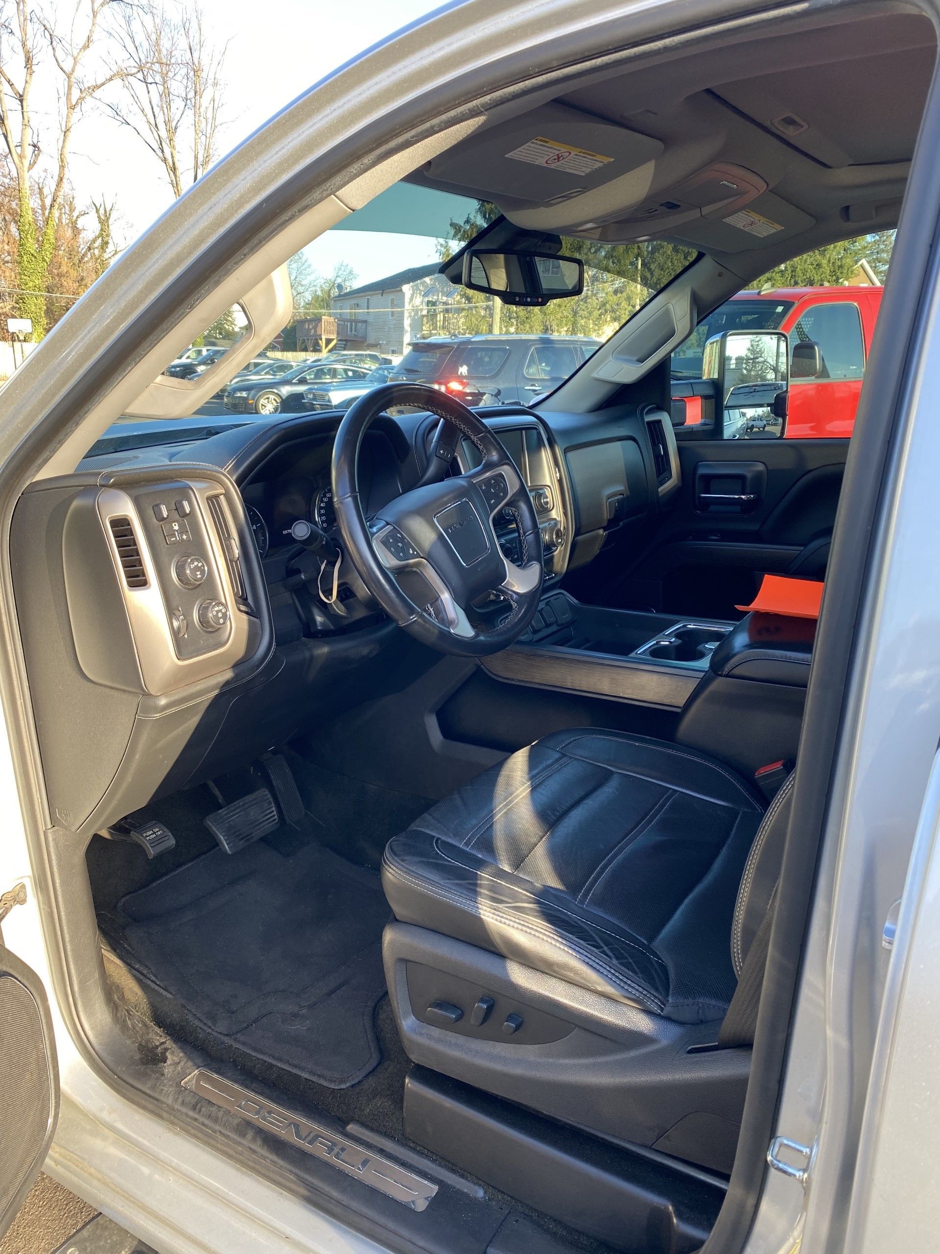 The interior of a silver truck with the door open. | InTown Auto Care