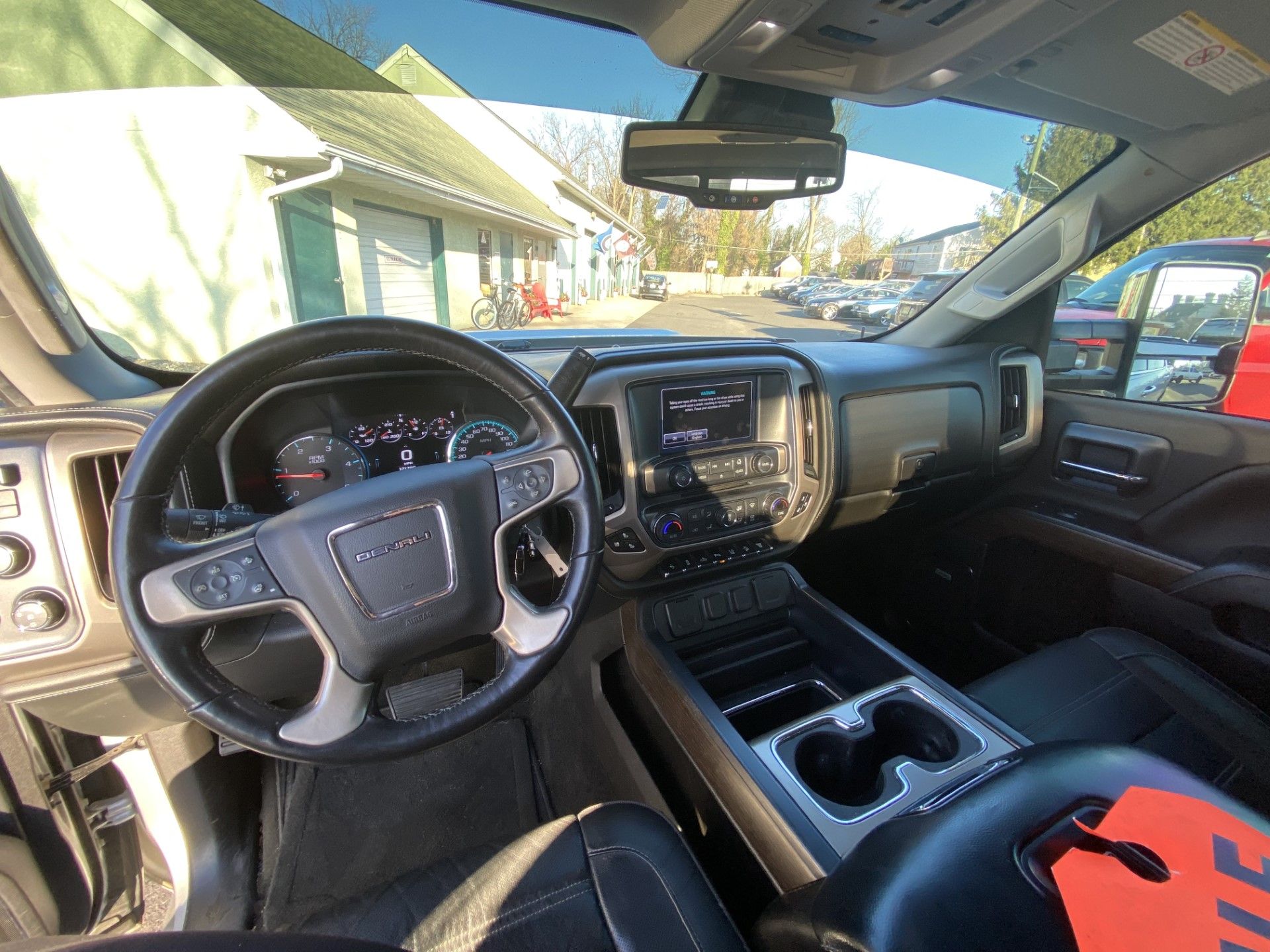 The inside of a car with a steering wheel and dashboard. | InTown Auto Care
