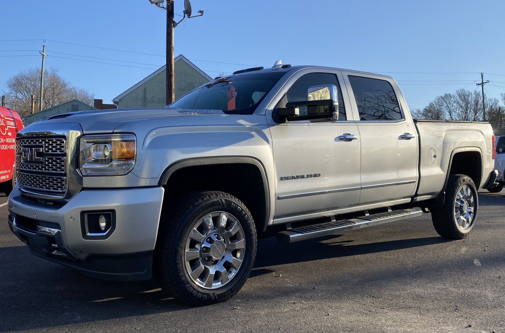 A silver pickup truck is parked on the side of the road. | InTown Auto Care