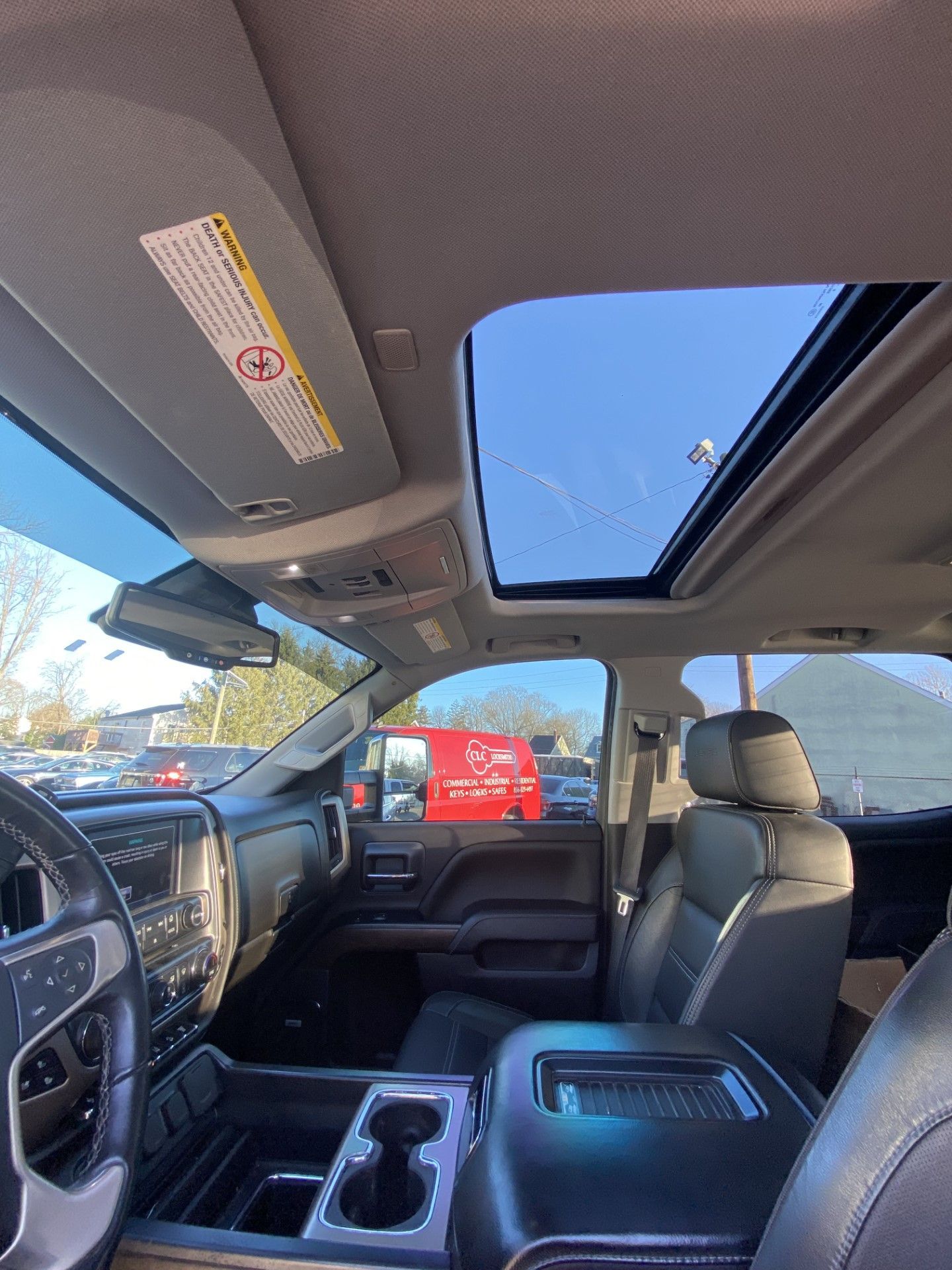 The inside of a truck with a sunroof and a steering wheel. | InTown Auto Care
