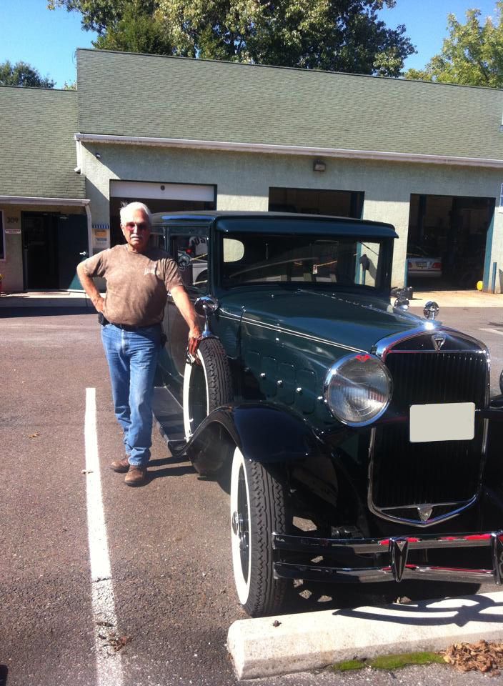 A Man Standing Next to Old Vehile in a Parking Lot in Moorestown, NJ - InTown Auto Care