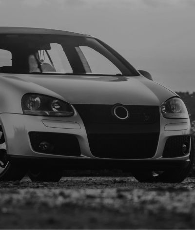 A black and white photo of a volkswagen golf