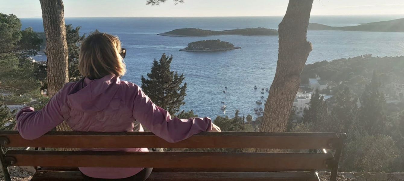 A local lady enjoying the sea view.