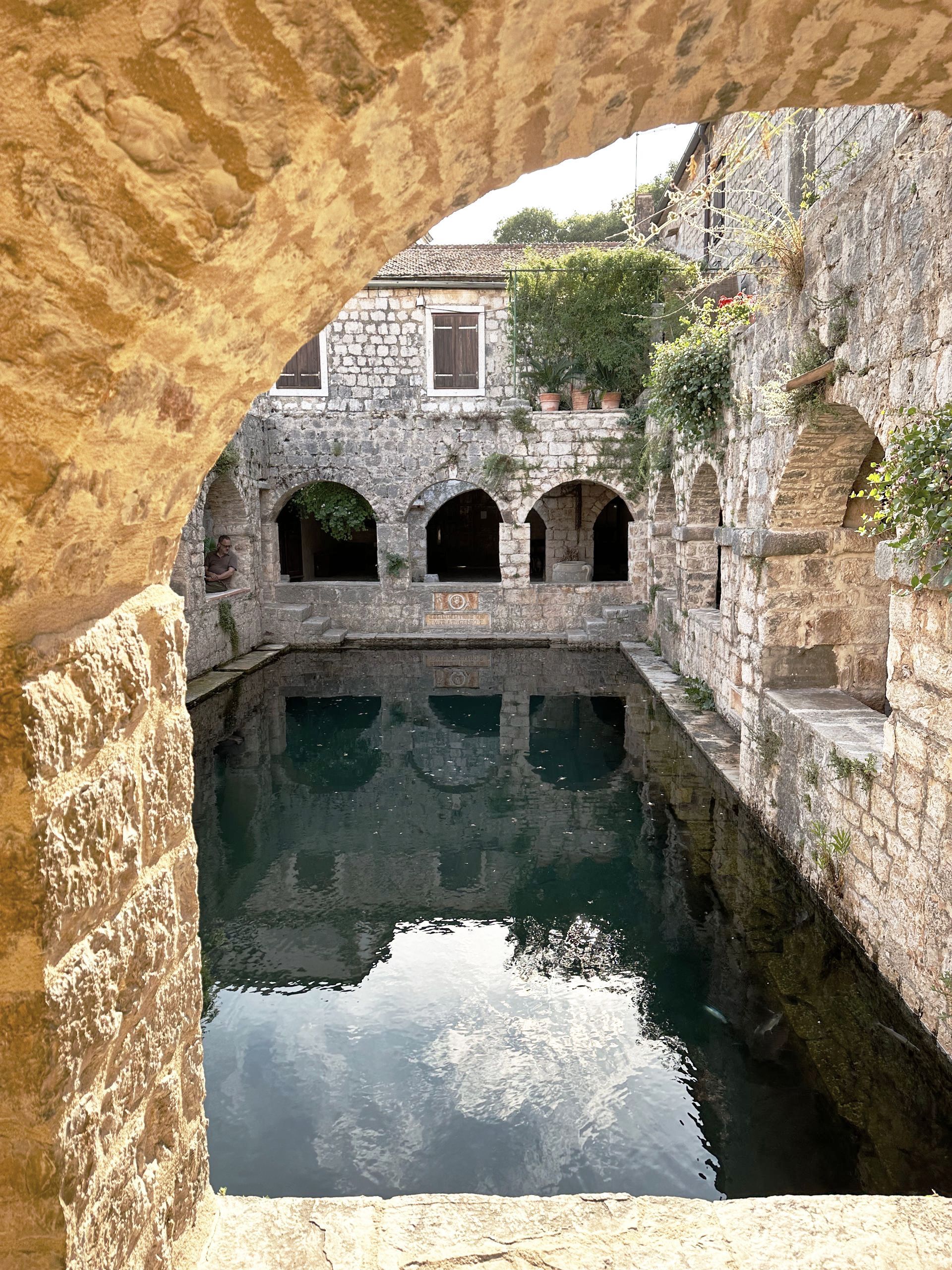 Tvrdalj Museum in Stari Grad with a picturesque pond