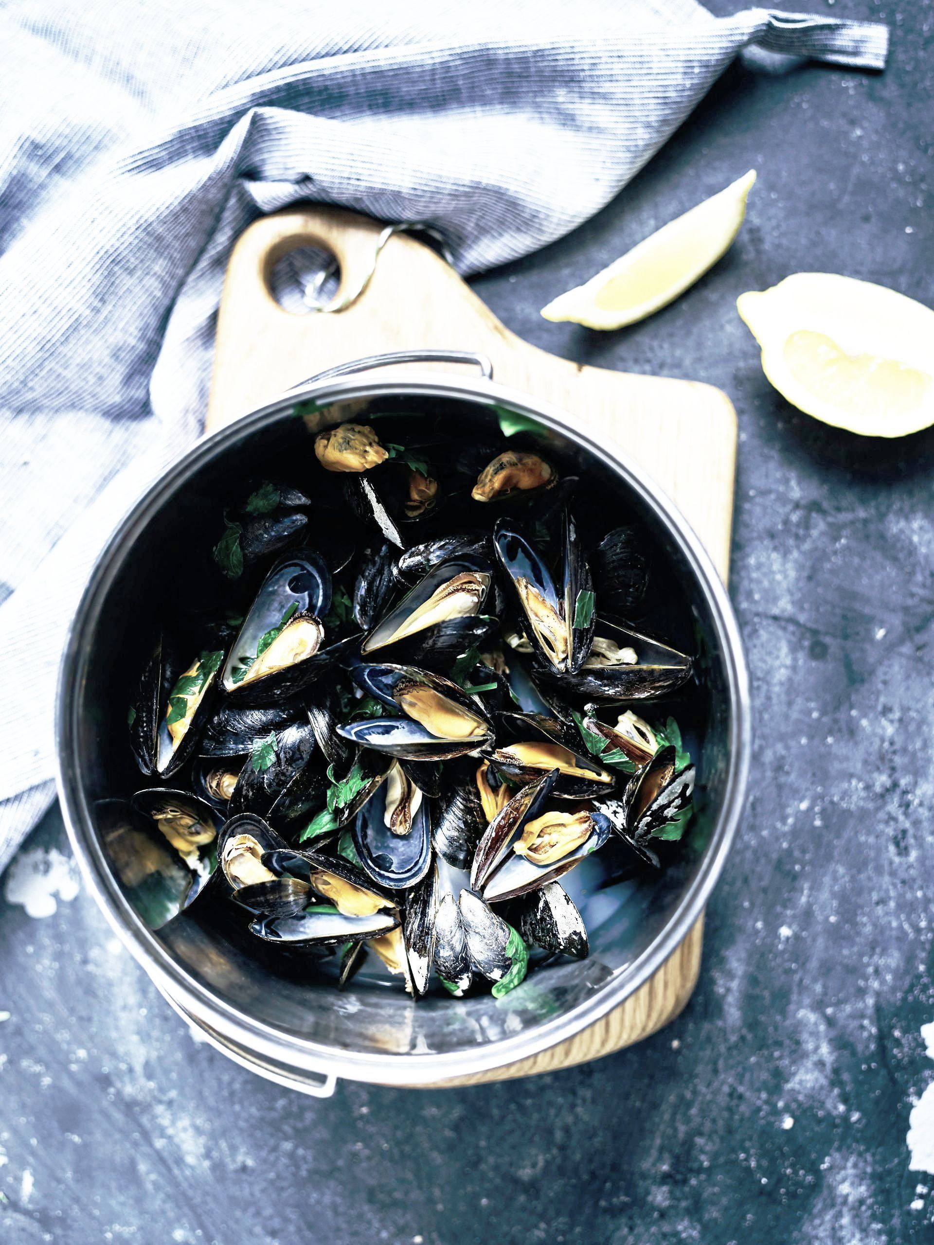 Freshly prepared seafood dish featuring assorted shells, served in a traditional Dalmatian style
