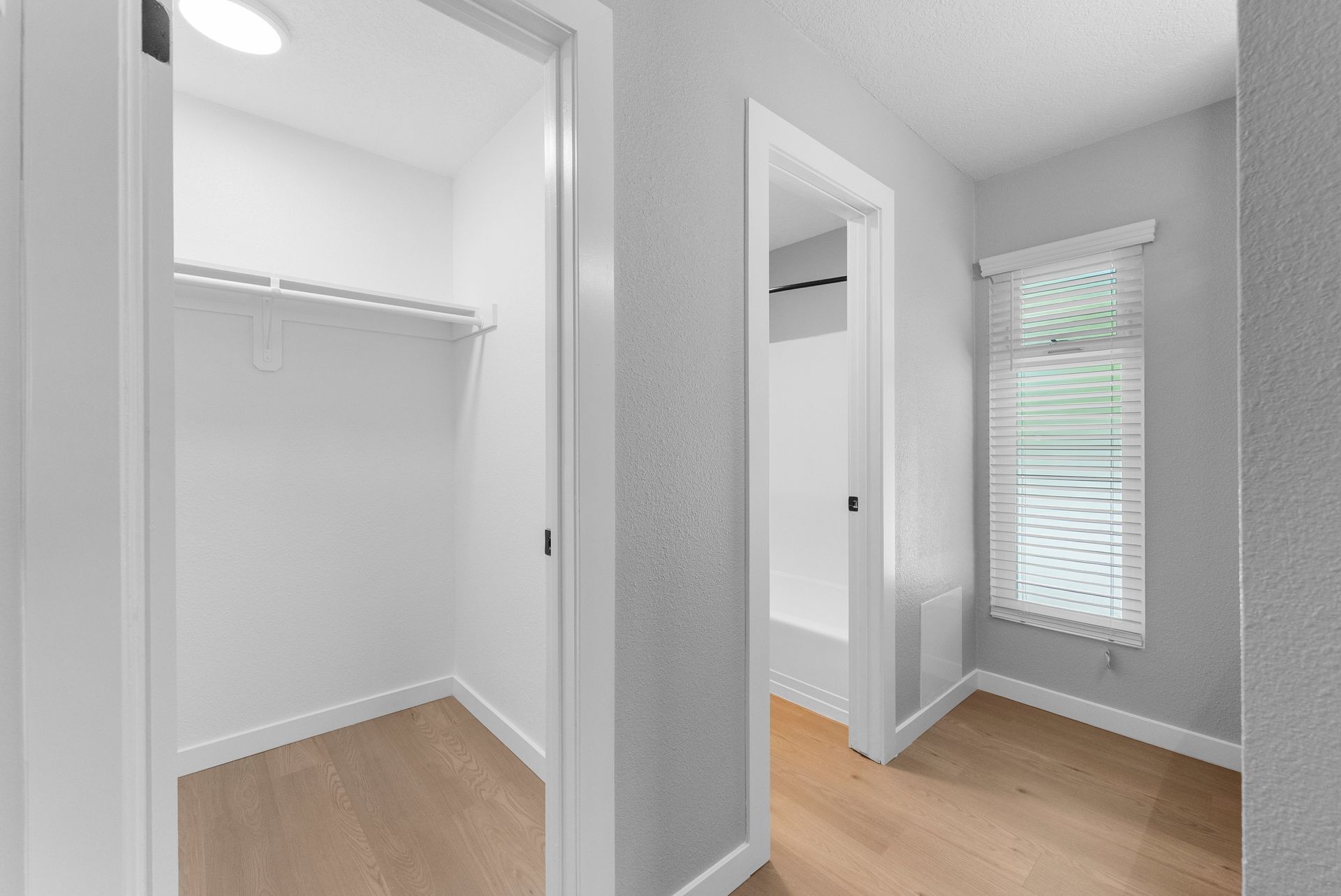 There is a walk in closet in the middle of the room.