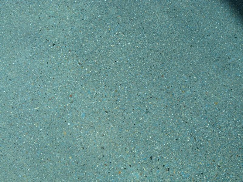 Light blue-green speckled textured surface