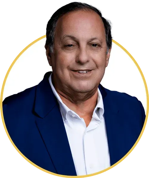 Headshot of a smiling man in a blue blazer and white shirt inside a gold circle