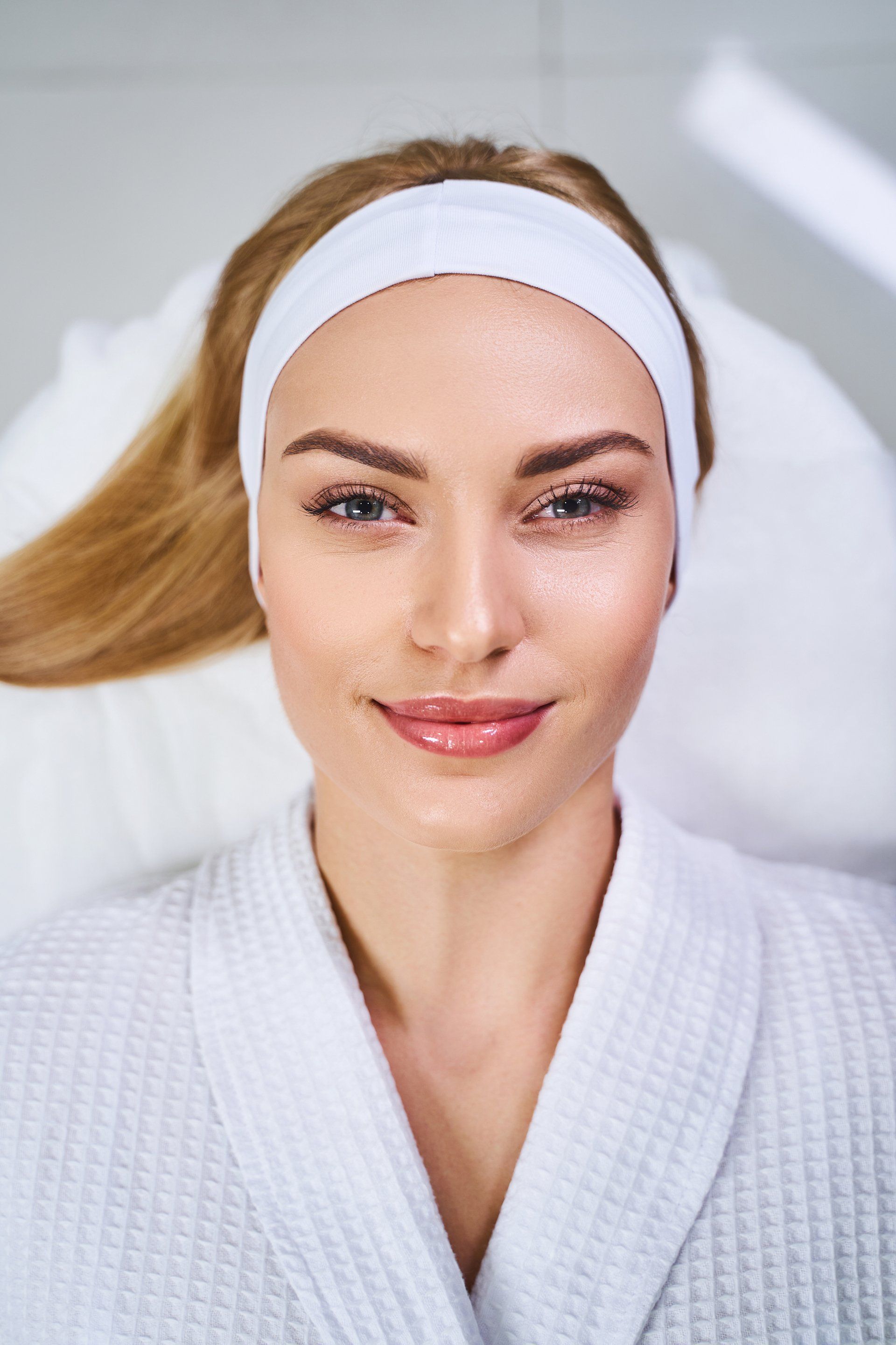 happy young woman after beauty care treatment
