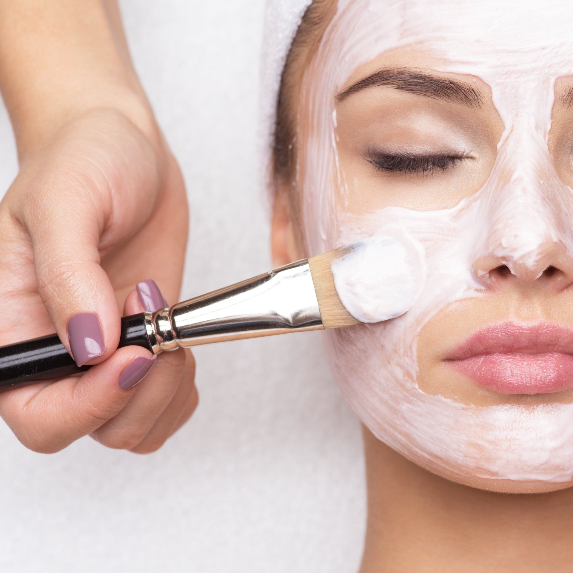 woman receiving facial treatment