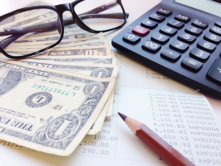 Money, Calculator and Financial Statement — Slidell, LA — Key Credit Inc. Money, Calculator and Financial Statement — Slidell, LA — Key Credit Inc.