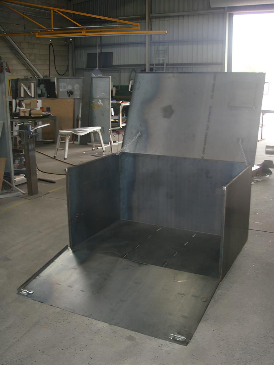 A Large Metal Box Is Sitting On The Floor In A Factory — Brian Martin's Sheet Metal In North Mackay, QLD
