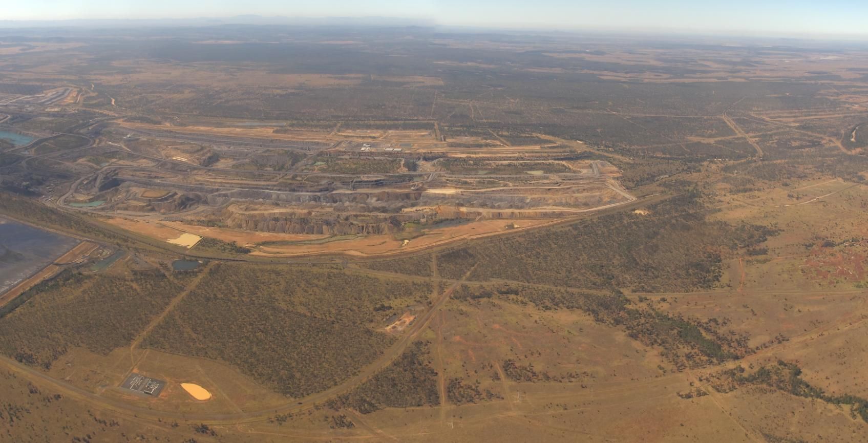 An Aerial View Of A Desert Landscape With A City — Brian Martin's Sheet Metal In Moranbah, QLD
