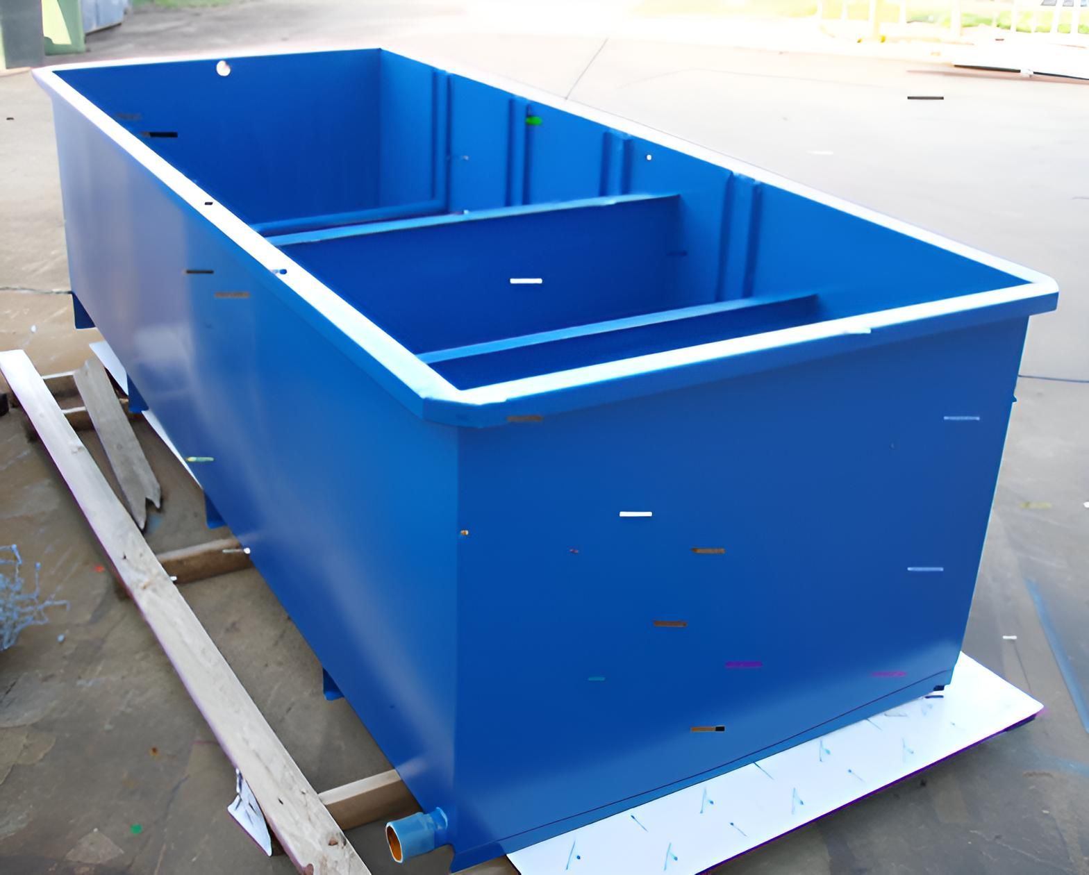 A Large Blue Tank Is Sitting On A Wooden Pallet — Brian Martin's Sheet Metal In North Mackay, QLD