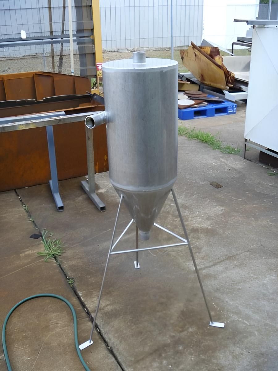A Stainless Steel Container Is Sitting On A Concrete Floor — Brian Martin's Sheet Metal In North Mackay, QLD