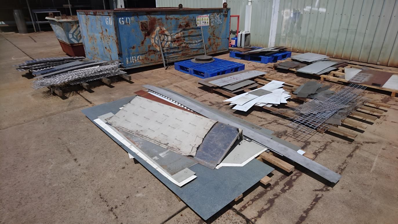A Bunch Of Pieces Of Metal Are Laying On The Ground — Brian Martin's Sheet Metal In Whitsundays, QLD